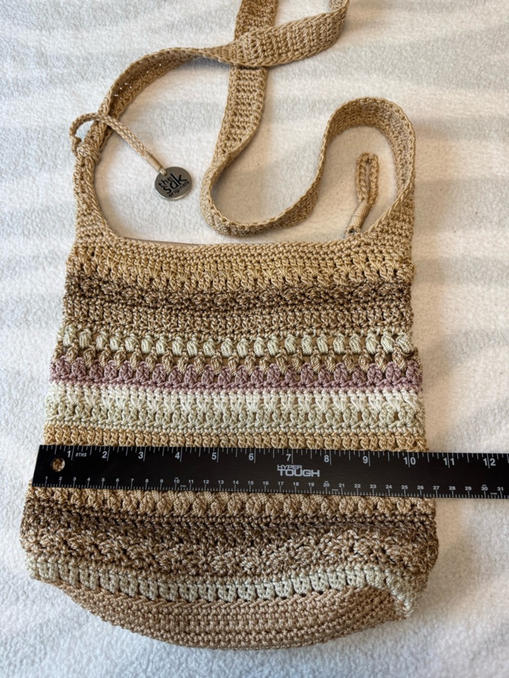 The Sak Crochet Neutral Stripe Crossbody Bag in Beige and Mauve